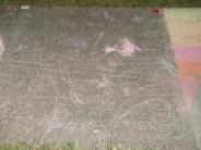 childlike sidewalk chalk art pink lines and scribbles