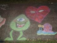 sidewalk chalk art green alien with one eye, a red heart monster and a blue snail with a pink shell