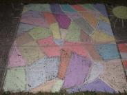 abstract sidewalk chalk art in many colors