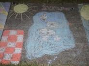 sidewalk chalk art red and white checkers yellow sun