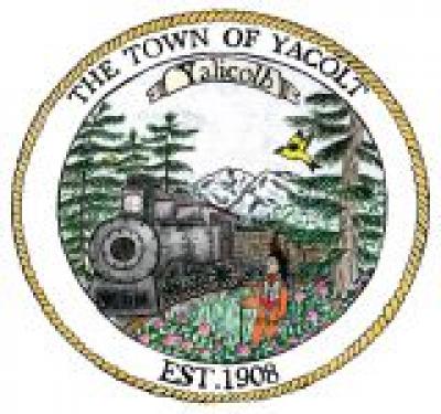 Yacolt Town Seal of Train approaching through forest with mountain in background